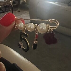 Elegant Gold and Black Charm Brooch